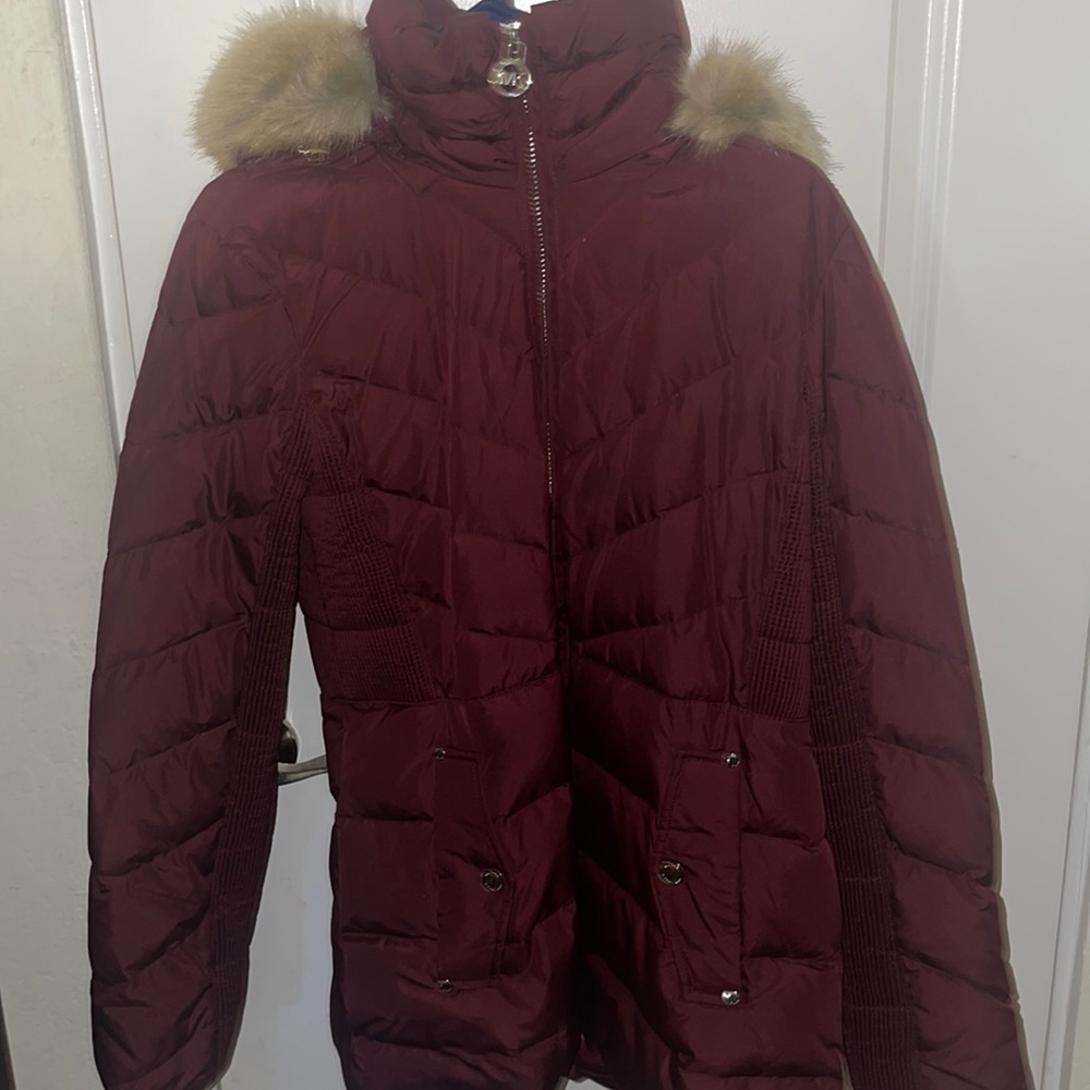 Micheal Kors jacket its a size medium and the color is maroon